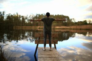 A person by the water who has learned to manage PSB triggers