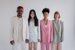 A group of diverse individuals stands together, symbolizing inclusivity in recovery processes.