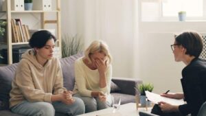 A family therapy session highlighting open communication and emotional support among loved ones.