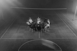 A circle of individuals seated in group therapy