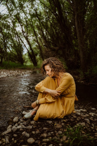 Woman sitting alone outdoor thinking deeply.