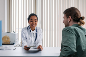 An image of a doctor talking to a man