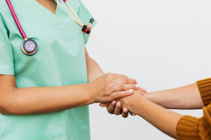 An image of a person holding another person’s hand