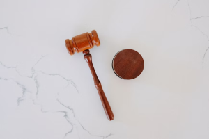 An image of a gavel on a white table