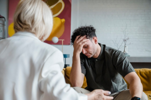 Men in a counseling circle discussing coping strategies for compulsive sexual behaviors