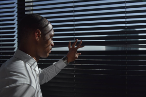 Man looking out the window.