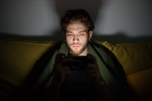 man sitting in dark