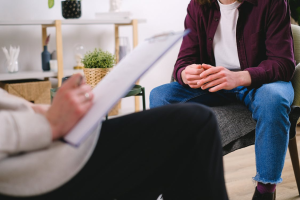 man sitting in therapy