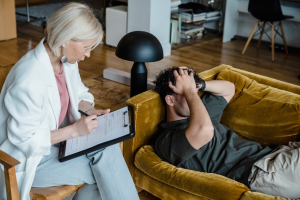 a man struggling during a therapy session