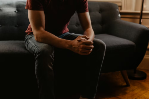 A man sitting on a sofa