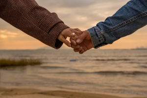 A man and woman holding hands